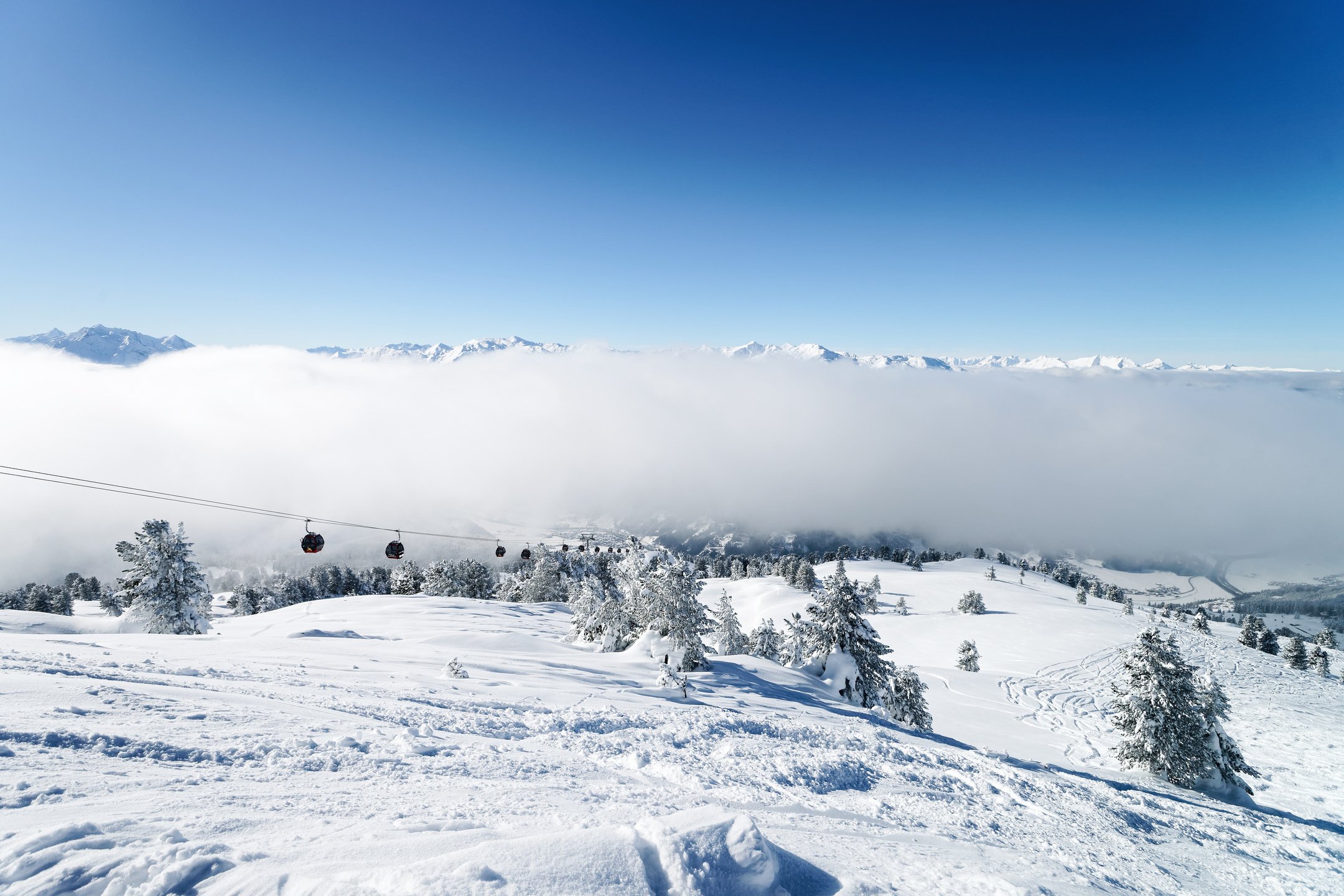 Ski lifts and Clouds Zillertal Arena ski resort Austria