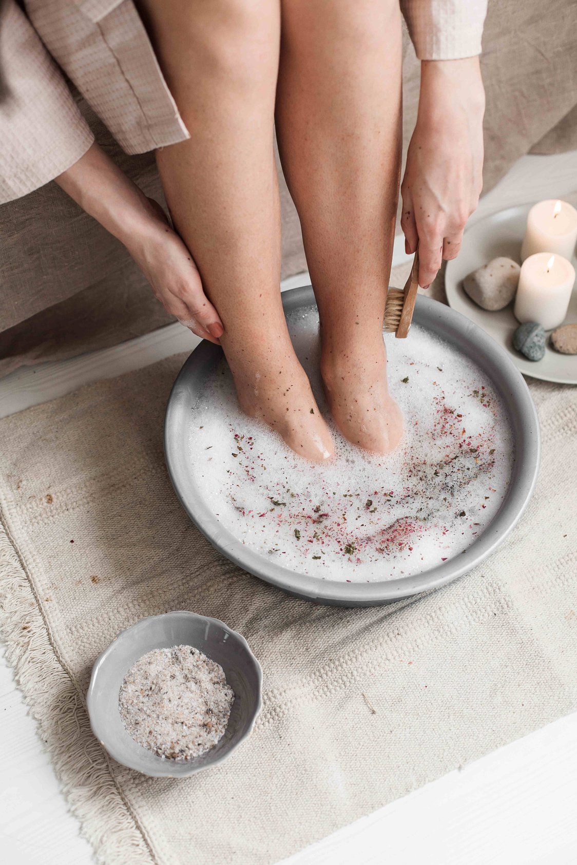 Woman Giving Herself a Foot Spa